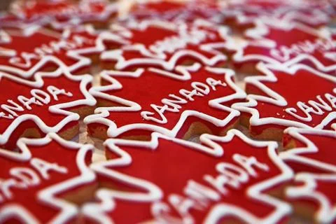 Gingerbread in the form of red, maple leaves, marked Canadian. in the window  Stock Photos