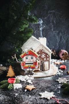 Gingerbread house and The Nutcracker gingerbread cookie. Stock Photos
