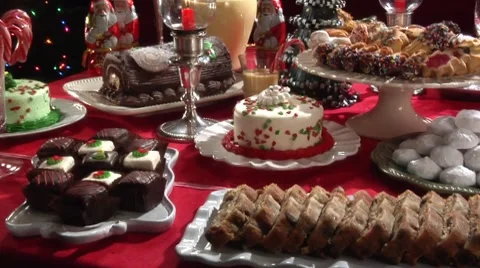 Gingerbread house and sweet baking on Christmas cake buffet Stock Footage
