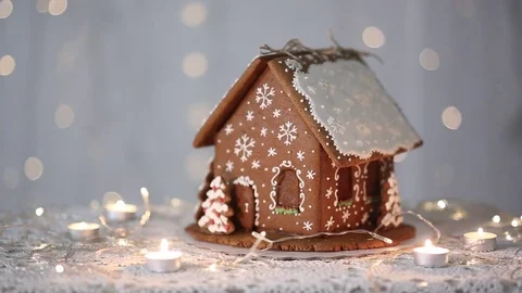 Gingerbread house on the background of lights, decorated with snowflakes Stock-Footage 70791251