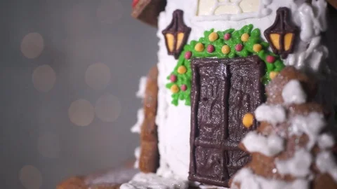 Gingerbread house on the background of lights, white and chocolate glaze Stock Footage 70791249