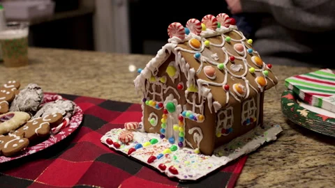 Gingerbread house close up festive decorations. Candy, frosting and gingerbread  Stock Footage 260030281