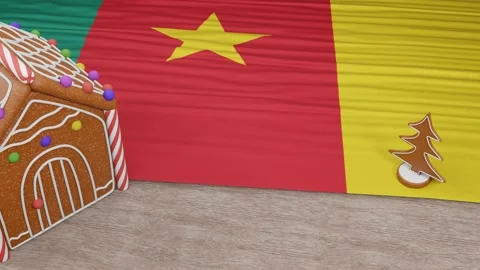 Gingerbread house with the flag of Cameroon on the table Video stock 167764664