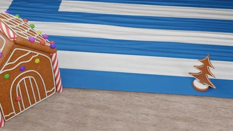 Gingerbread house with the flag of Greece on the table Stock Footage 167764704