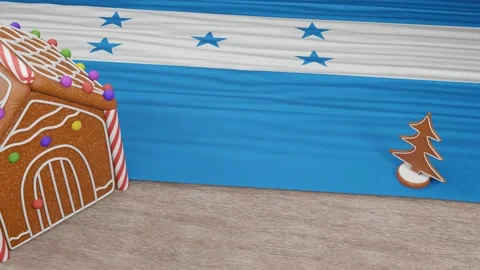 Gingerbread house with the flag of Honduras on the table Video stock 167764718