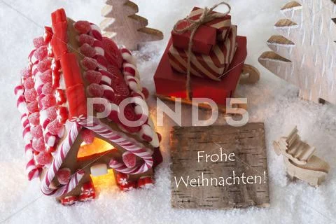 Gingerbread House, Sled, Snow, Frohe Weihnachten Means Merry Christmas Stock Photos