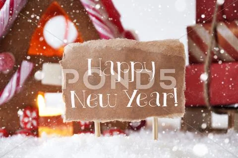 Gingerbread House With Sled, Snowflakes, Text Happy New Year Stock Photos