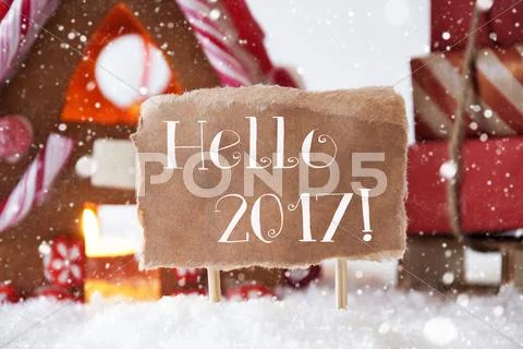 Gingerbread House With Sled, Snowflakes, Text Hello 2017 Stock Photos