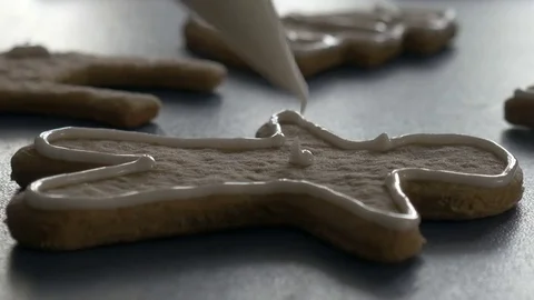 Gingerbread man cookie with glaze, extreme closeup ungraded Stock Footage 83447569