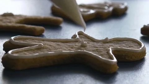 Gingerbread man cookie with glaze, extreme closeup color graded Stock Footage 83447777