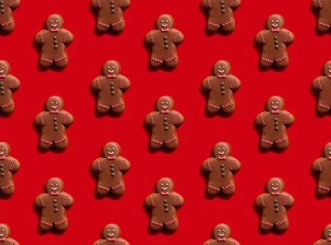 Gingerbread man pattern red seamless background Stock Photos