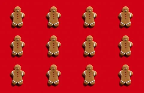 Gingerbread man pattern red seamless background Stock Photos