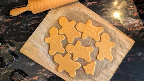 Gingerbread Man Raw Cookie Dough Shapes Ready for Christmas Baking Stock Photos