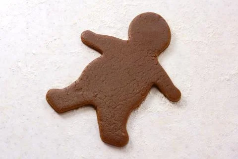 Gingerbread man shape in cookie dough Stock Photos
