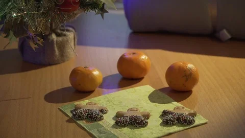 Gingerbread men cookies being laying out by woman's hand Stock Footage 84094236