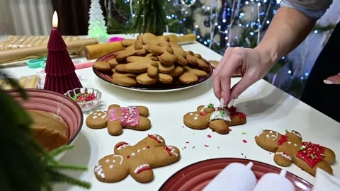 Gingerbread men decoration with beautiful hands and Christmas spirit Stock Footage 344820808