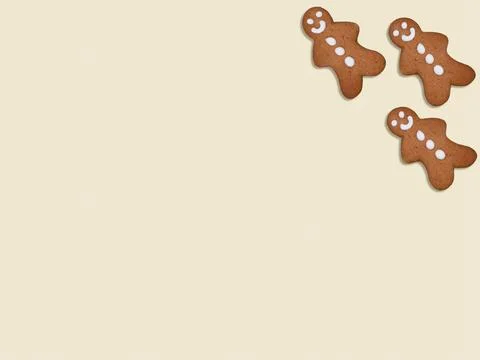Gingerbread men on light background with copy space Stock Photos