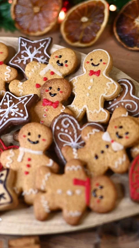 Gingerbread men on a wood table Stock Footage 294936435