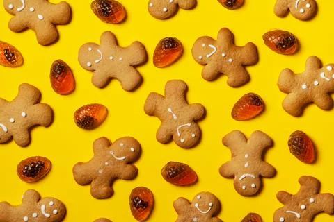Gingerbread men on a yellow background. Stock Photos