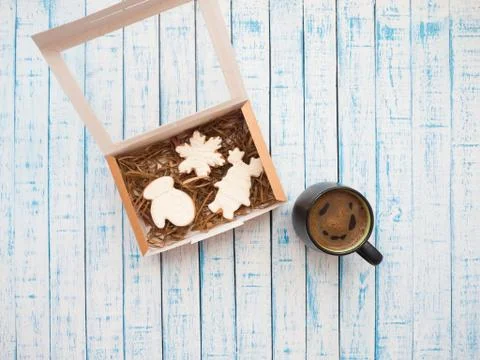 Gingerbread in packaging and coffee on an old table in French style Stock Photos