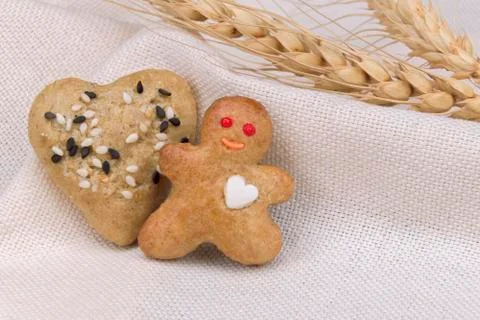 Gingerbread shortbread cookie (men and hearts) with black and white sesame Stock Photos