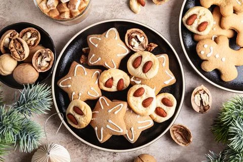 Gingerbread stars and cookies with almonds. Stock Photos