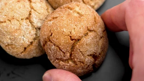 Gingersnap cookies. Hand picking crispy snack Stock Footage 310608907