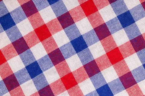 Gingham fabric featuring red blue white checkered pattern Foto stock