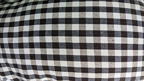 Gingham textile with a subtle variation in shades of brown and gray. Close-.. Stock Photos