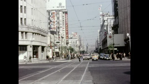Ginza District - Intersection with cars approaching 1960s Video stock 230053017