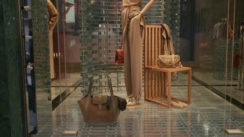 Giorgio Armani SS26 window display featuring elegant handbags and chic Stock Footage 330033571