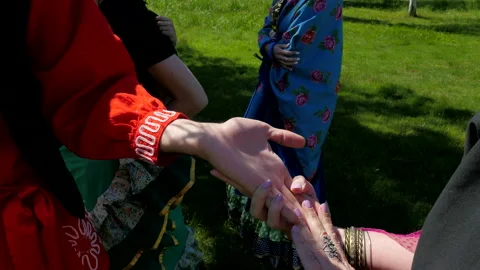 Gipsy fortune teller does palm reading on hands, chiromancy or palmistry concept Stock Footage 161481093