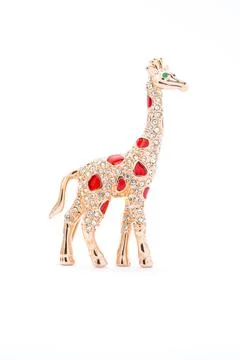 Giraffe brooch on a white background Stock Photos