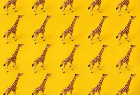 Giraffe texture pattern on yellow vivid background. Creative Concept photo. Stock Photos