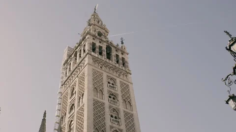 The Giralda and the plane. Stock Footage 197031250