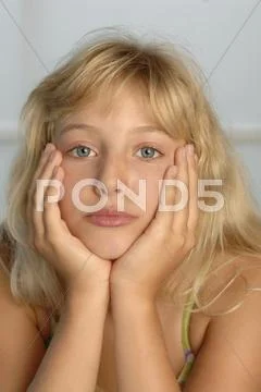 Girl (8-11) with hand on chin, portrait Stock Photos
