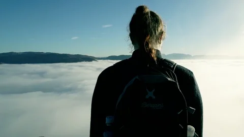 Girl above the clouds Stock Footage 99540077