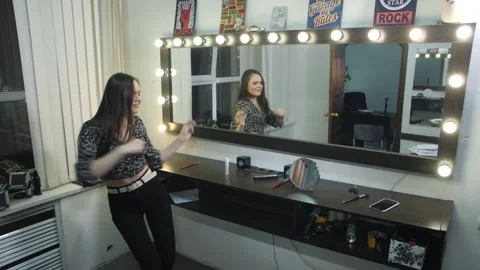  Girl is Actively Dancing to the Camera by the Mirror Stock Footage 144636549