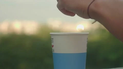 Girl Adding Sugar in a Cup of Coffee in Famous Kyiv Park Stock Footage 136039158