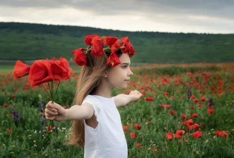 Girl among the spring field 스톡 사진
