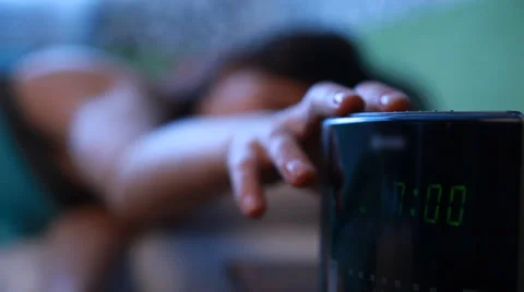 Girl and an alarm clock Stock Footage