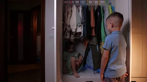 Girl and boy playing hide and seek game Stock Footage 236800129
