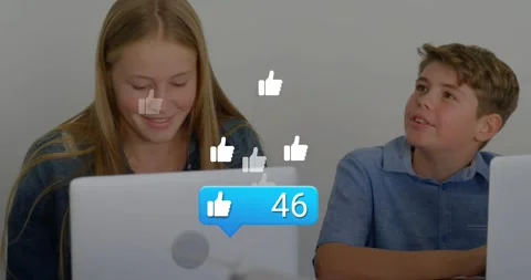 Girl and boy students using laptops, glancing at bubble appearing and raising Stock Footage 330208110
