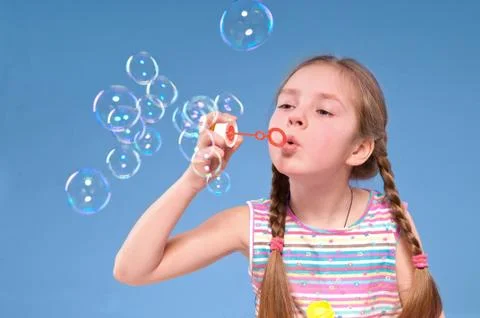 Girl and  bubbles Stock Photos