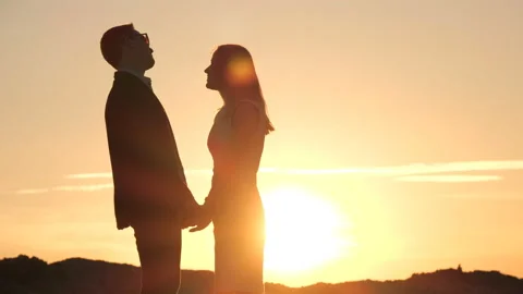 Girl and the guy at sunset Stock-Footage 91600379