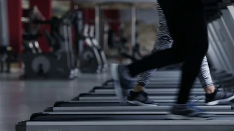 Girl and guy on the treadmill Stock Footage