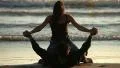 Girl and her boyfriend lying down on the beach in backlight HD Footage