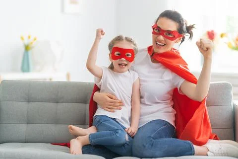 Girl and mom in Superhero costume Stock Photos