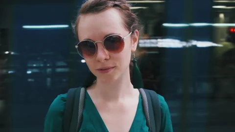 Girl and train loop. Loopable portrait of the young woman standing and looking Stock Footage 155150635