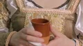 Girl in antique embroidered dress drinking at gala dinner, first night out HD Footage